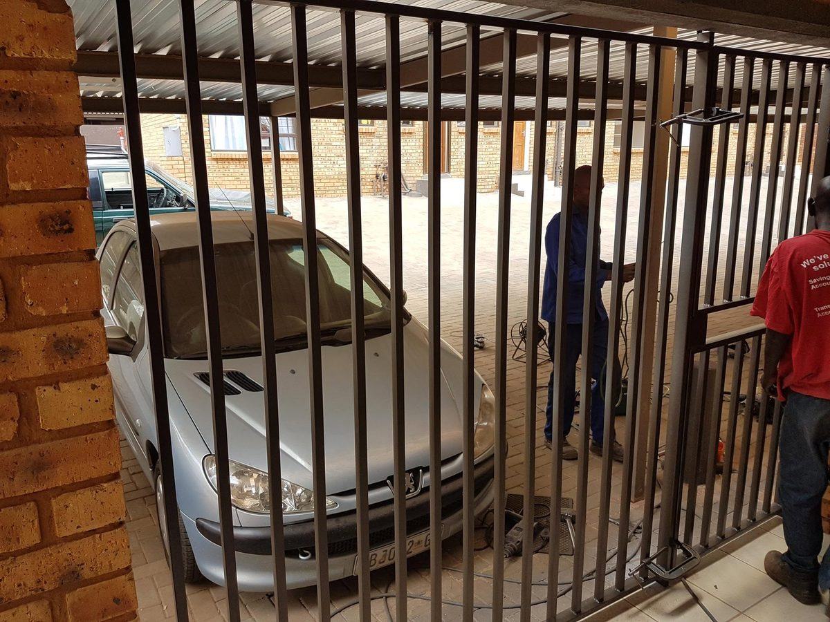 Curved steel driveway gate built for a Pretoria property