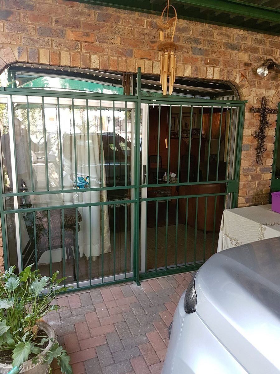 Green steel security gate and frame at a Pretoria home