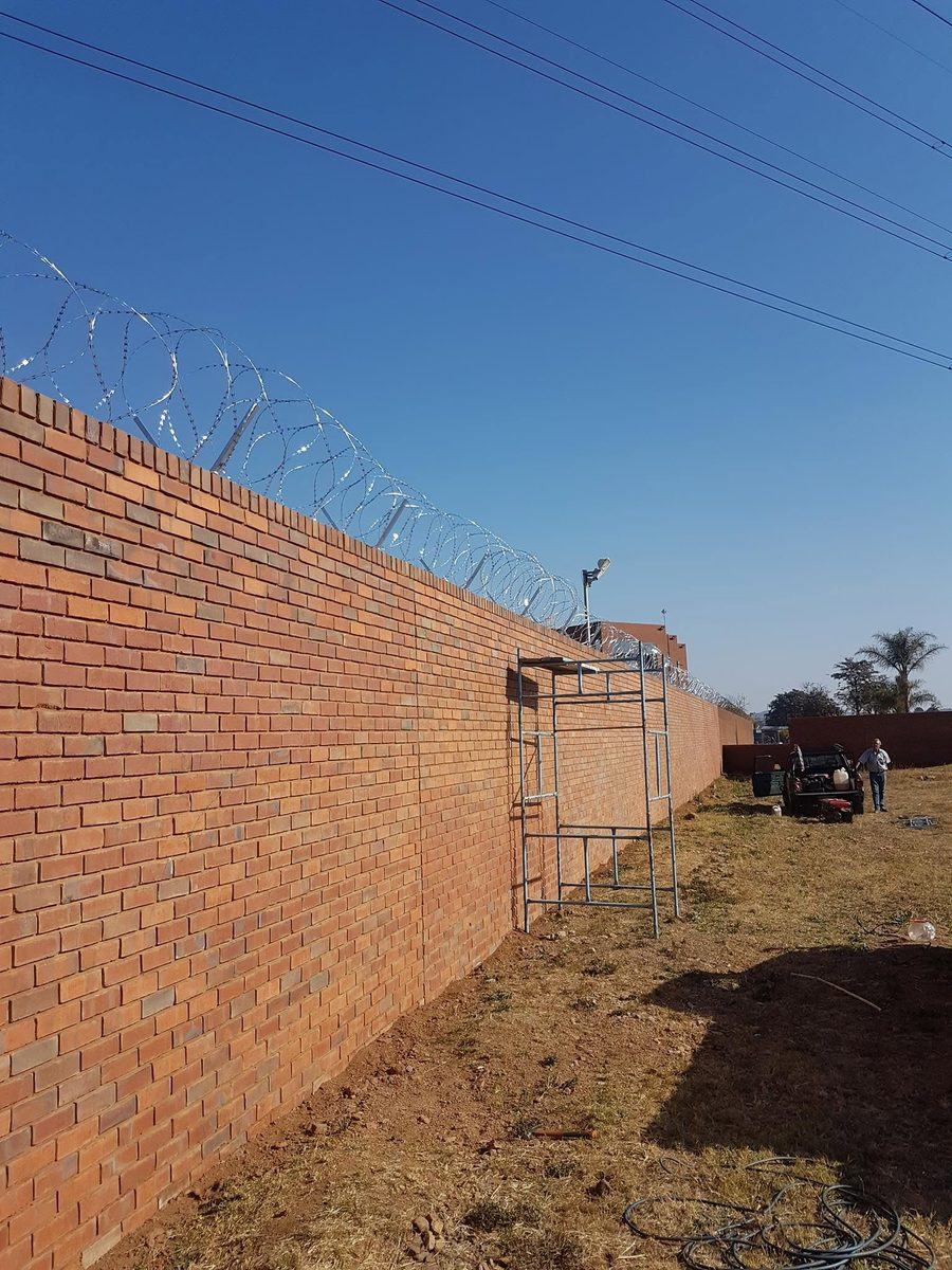 Boundary wall topped with electric fencing in Pretoria