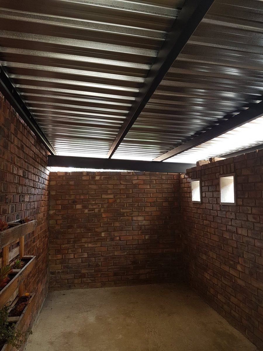 Interior of a steel carport with sheeted roof in Pretoria